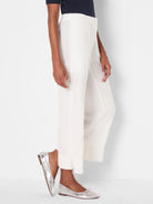 Off-white, wide-leg crop pants with an elasticated waist and subtle linen texture.