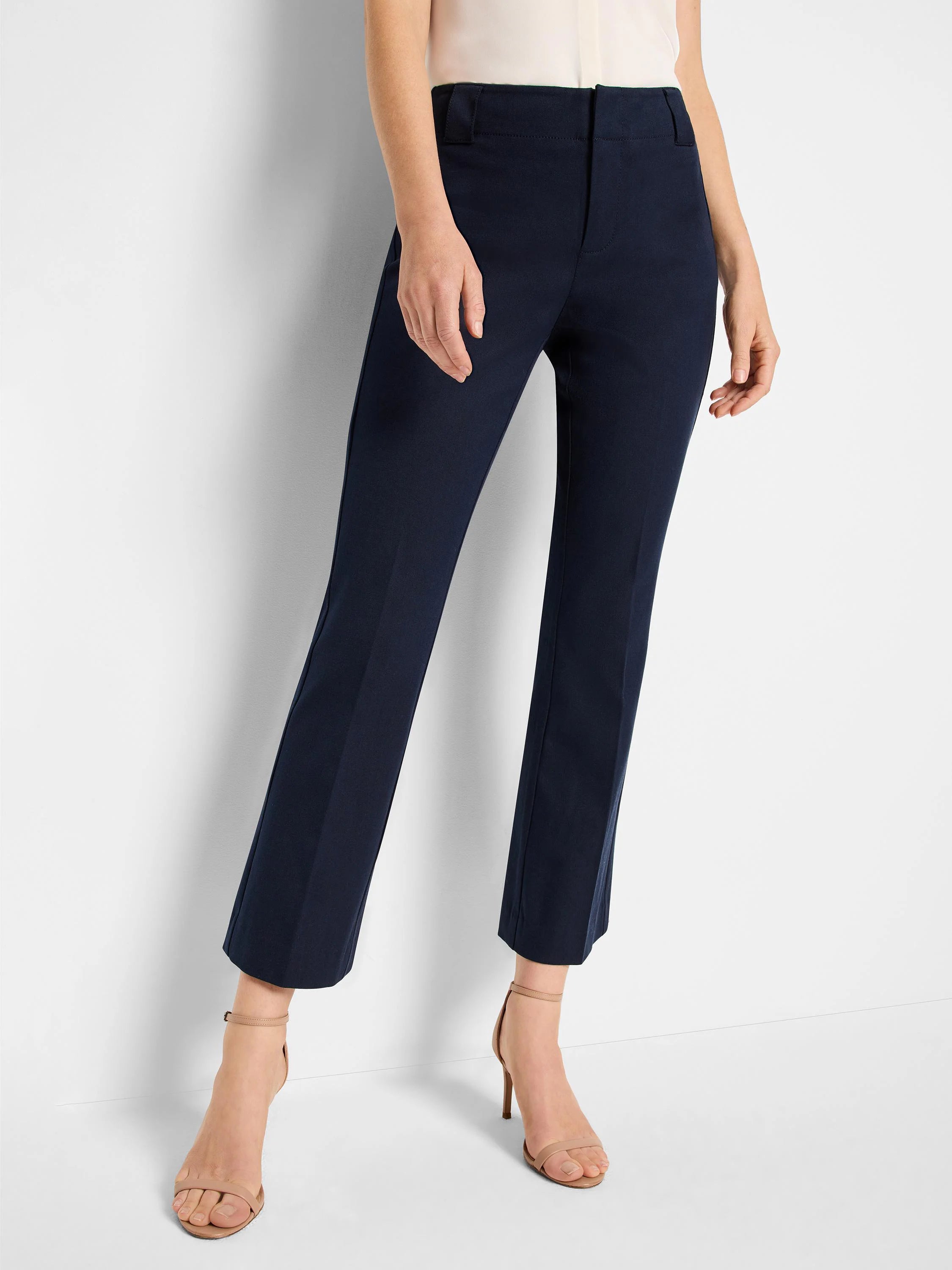 Dark navy demi-boot pants, cropped at the ankle. Features a flat front and visible belt loops.