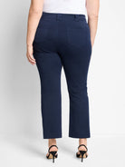 Rear view of navy demi boot cut pants. Slim fit with belt loops and two back patch pockets.