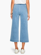 Here's alt text for the image, following all specifications:

Light blue, wide-leg cropped jeans with an elastic...