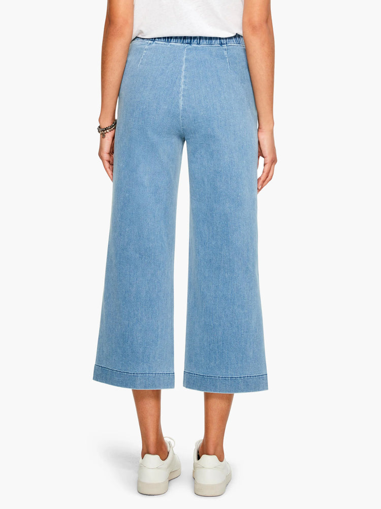 Here's alt text for the image, following all specifications:

Light blue, wide-leg cropped jeans with an elastic...