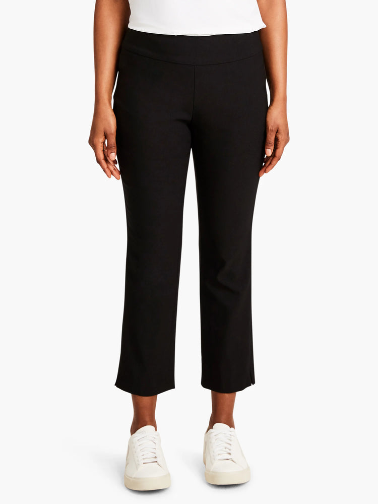 Black straight-leg cropped pants; slight slits at hems.  Model wears white sneakers.