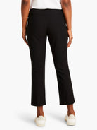 Black straight-leg cropped pants, shown from the back.  Pull-on style.  Model is wearing off-white sneakers.