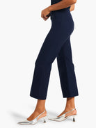 Dark blue, smooth, wide-leg crop pants worn above ankles on a model.