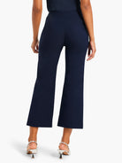 Dark blue wide-leg crop pants, shown from the back. Smooth, polished fabric with a wide leg cut, ending above the ankle.