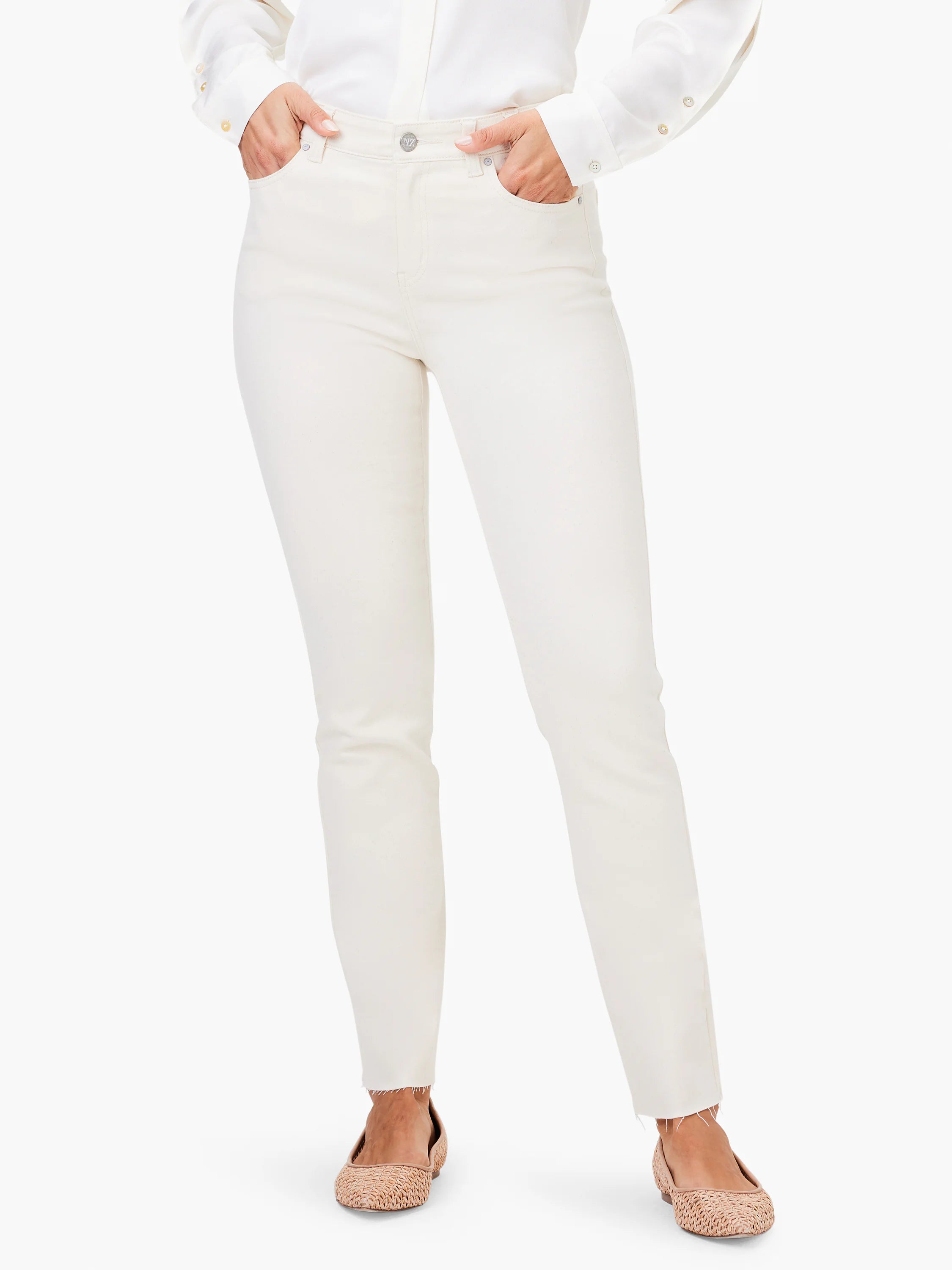 Cream straight ankle jeans with a frayed hem, silver button, and visible front pockets.