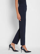 Dark navy straight leg pants with a wide, smooth, high waistband.