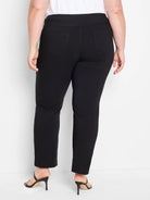 Black straight leg pants on a model from behind. Visible back patch pockets and a wide, smooth pull-on waistband.