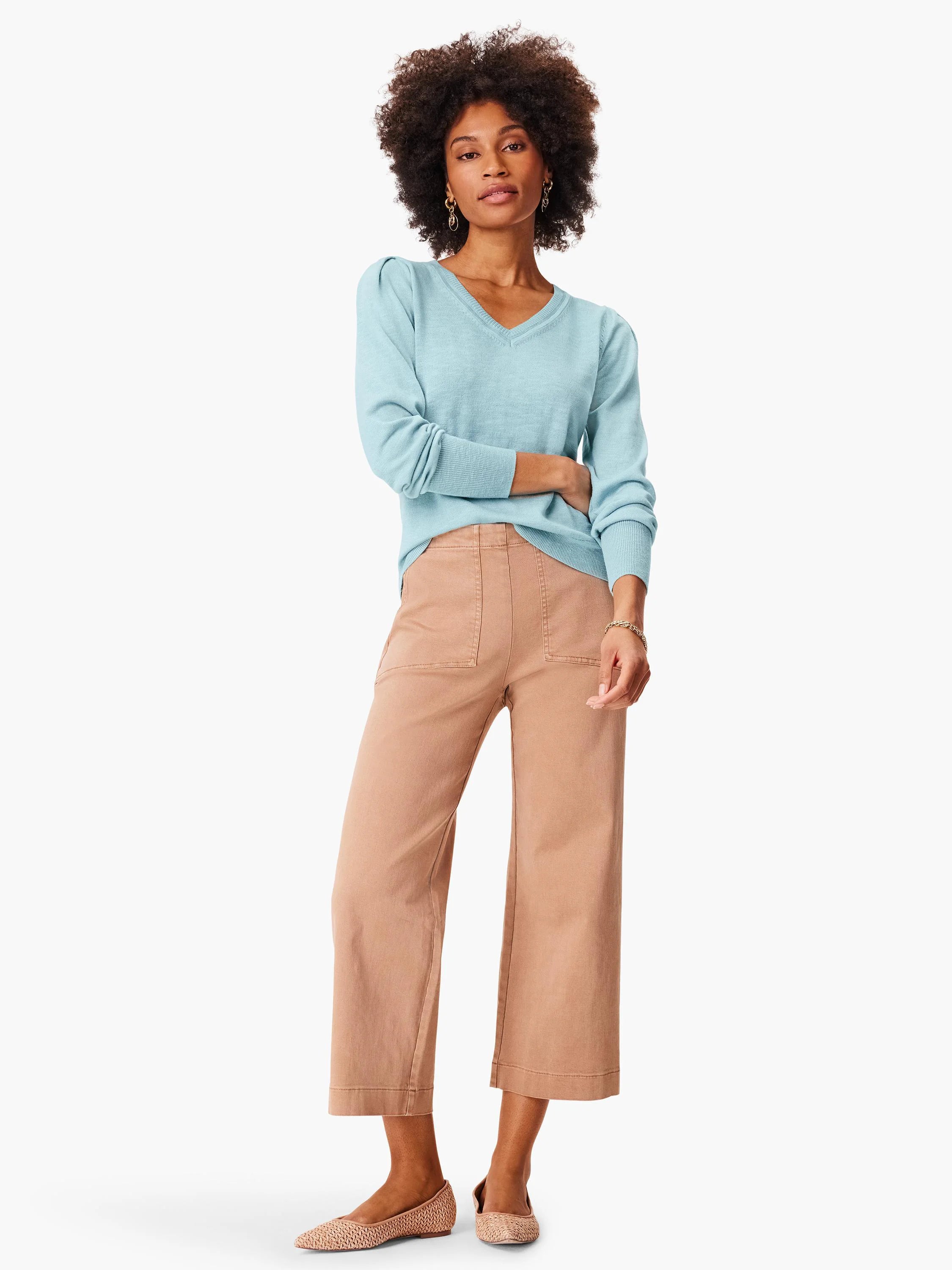 Tan high-waisted wide-leg jeans, cropped, with front patch pockets and vertical leg seams.
