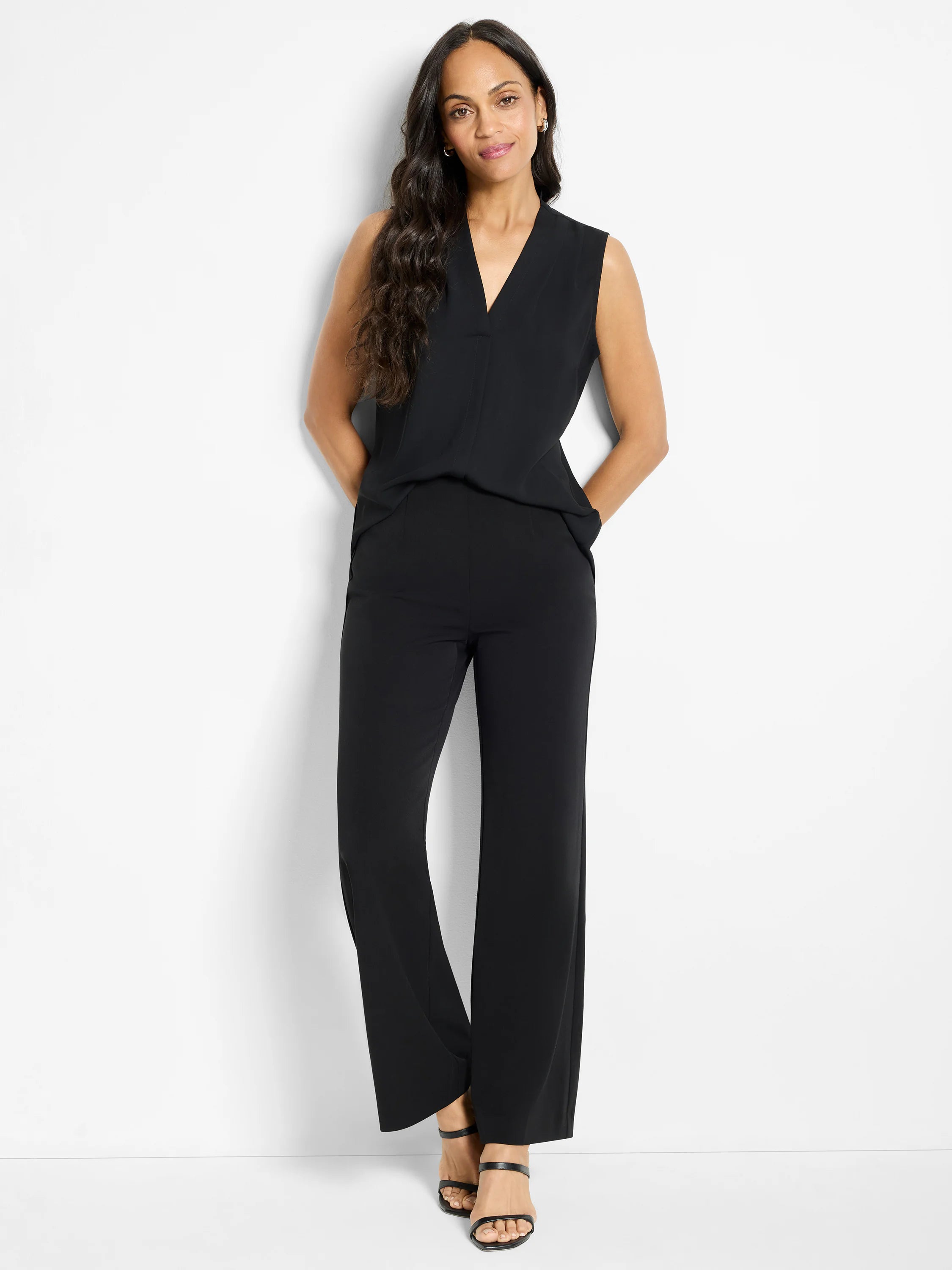 Black wide-leg trousers. Full length, smooth fabric, shown on a model.