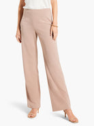 Light brown, high-waisted wide-leg trousers with smooth fabric, modeled on a person.