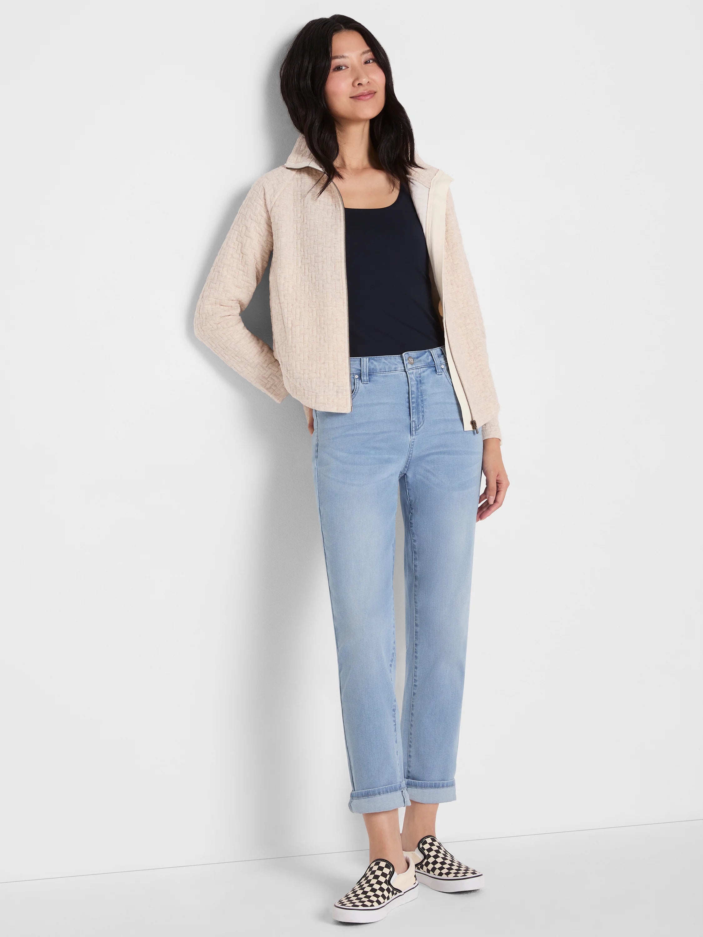 Light blue mid-rise girlfriend jeans, relaxed fit, with a light wash, subtle fading, and double cuffed at the ankle.