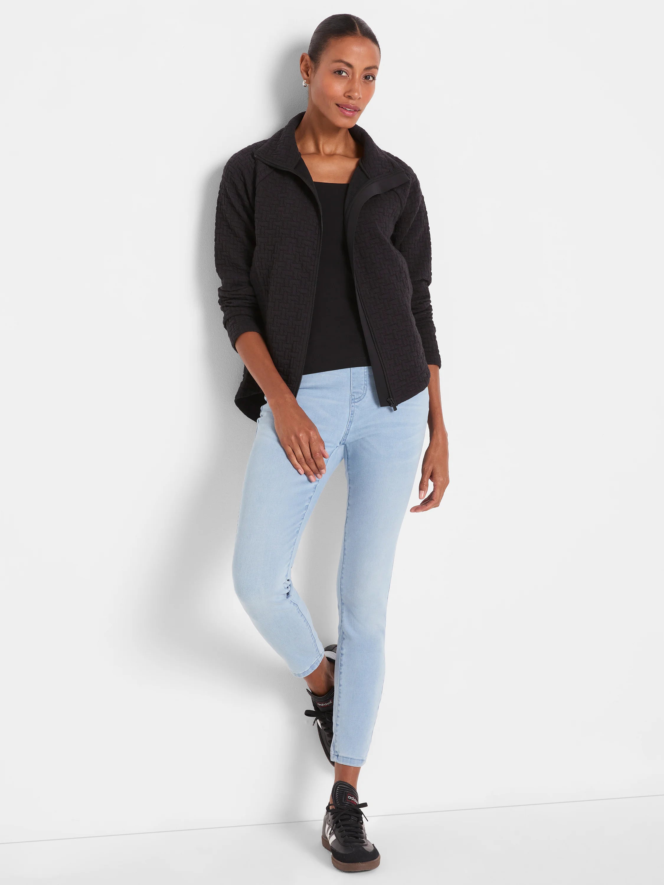 Light blue mid-rise slim ankle jeans with a smooth denim finish.