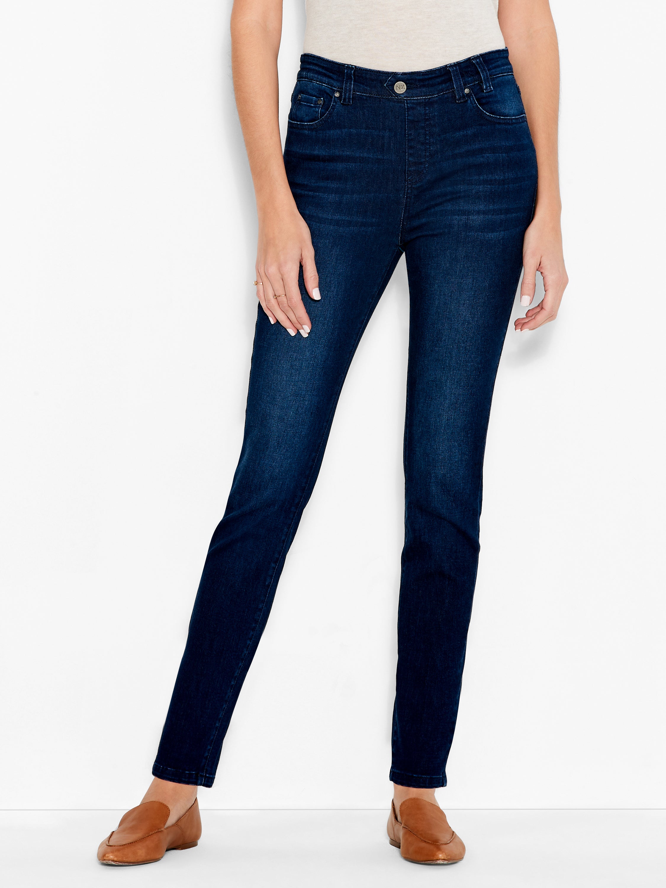 Dark wash denim jeans are shown in a slim straight fit with a mid-rise waist and traditional pocket details.
