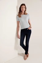 Dark blue denim, slim-fit ankle jeans.