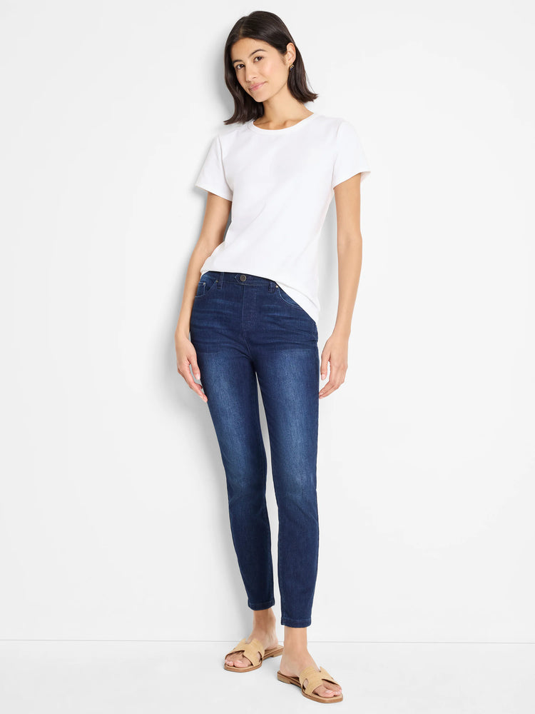 Dark wash, slim-fit ankle jeans on a model.  Mid-rise.