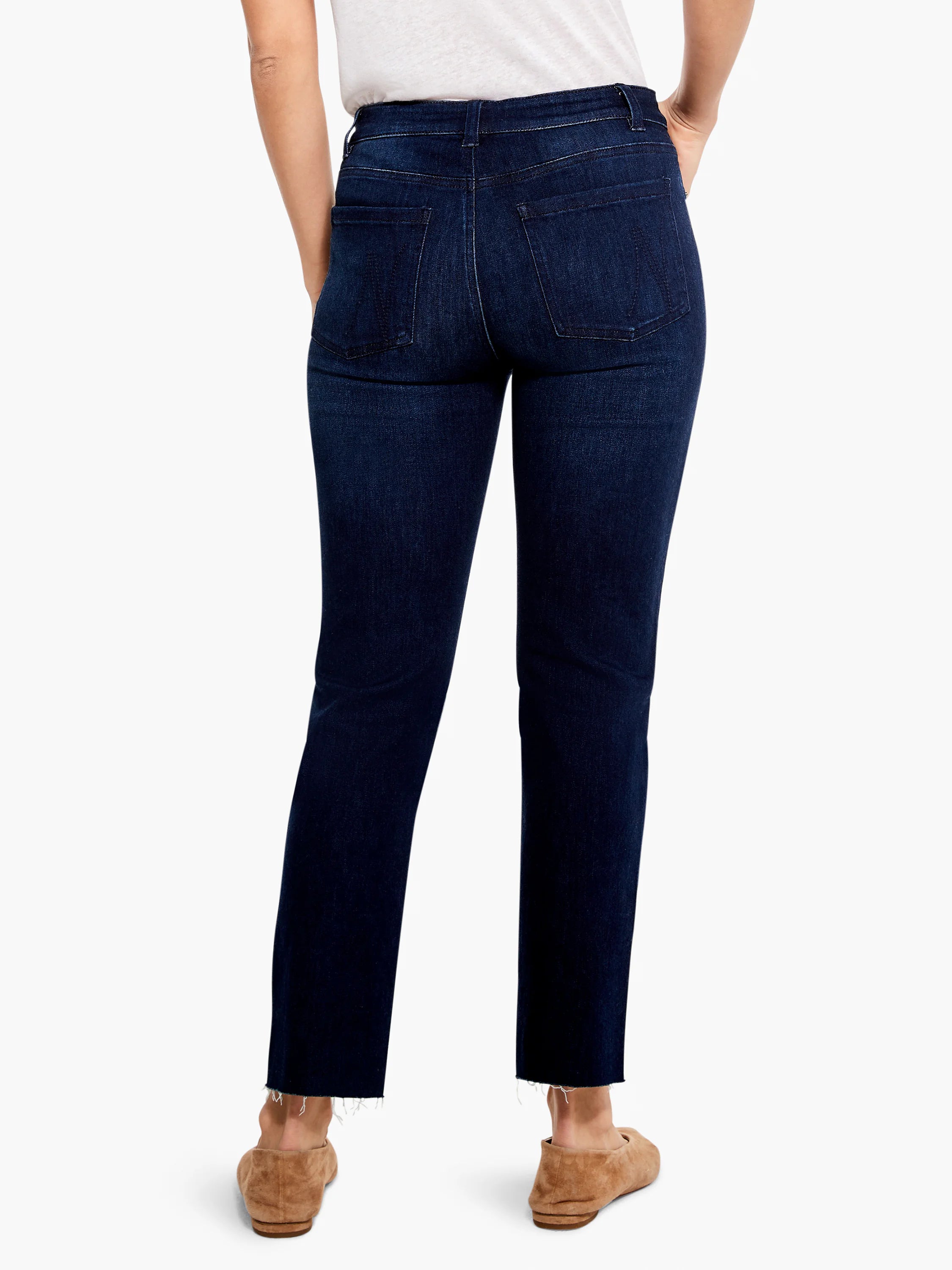 Dark blue straight ankle jeans from behind, featuring back pockets and a raw, frayed hem.