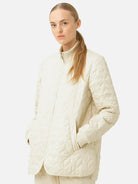 Off-white quilted jacket with knit collar and zip front.  Diamond quilting pattern.