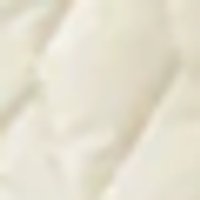 Pale sand, soft, padded fabric with gentle folds.