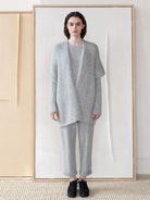 Light gray, loosely knit, open-front vest.  Relaxed fit, slightly dolman sleeves.
