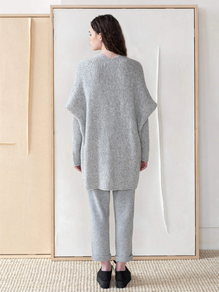 Light gray, oversized knit vest;  long sleeves, relaxed fit.