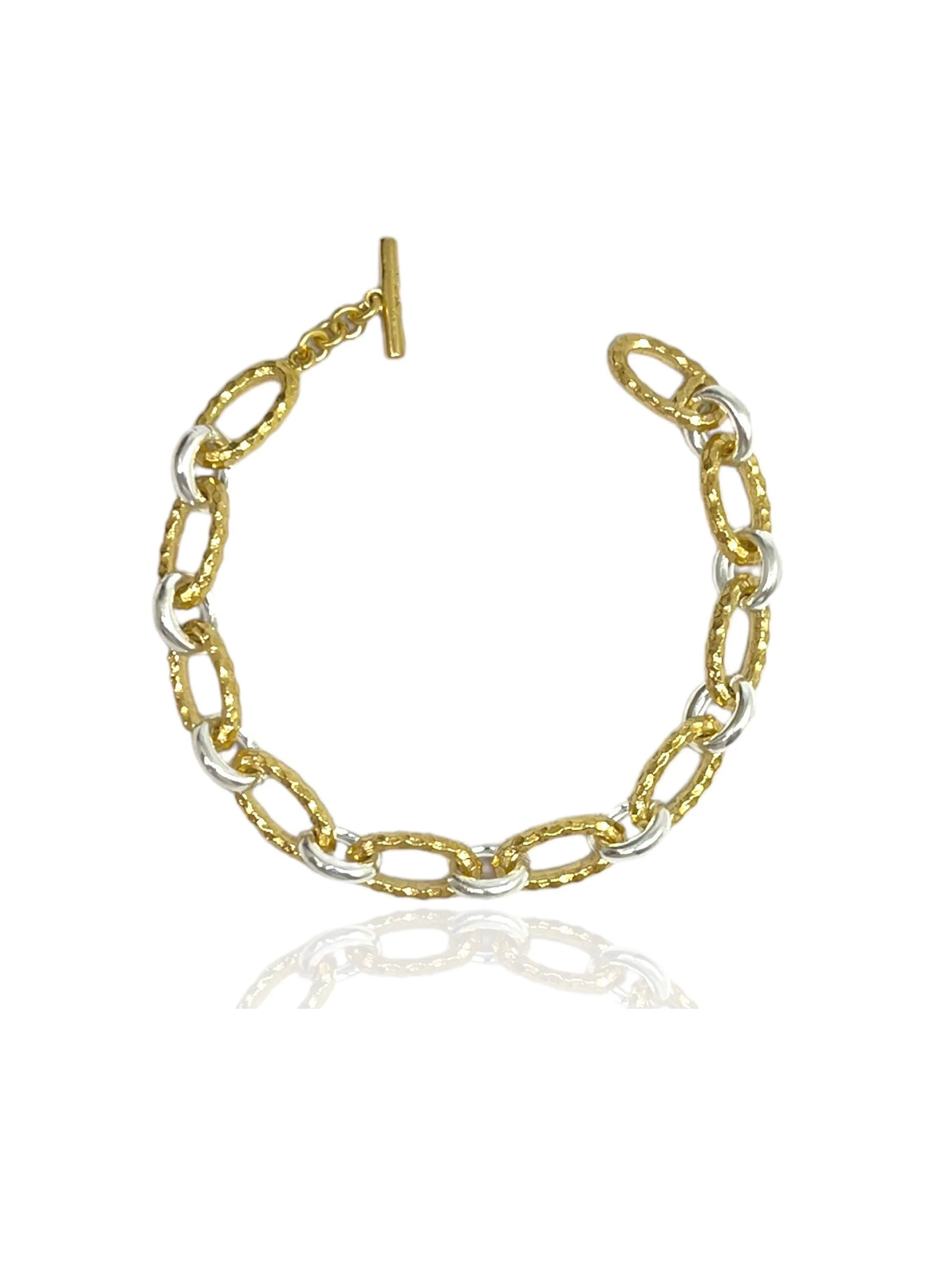 Gold and silver two-toned chain bracelet with textured links and a T-bar clasp.