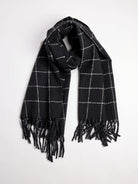Dark gray scarf with off-white windowpane grid and fringed ends.