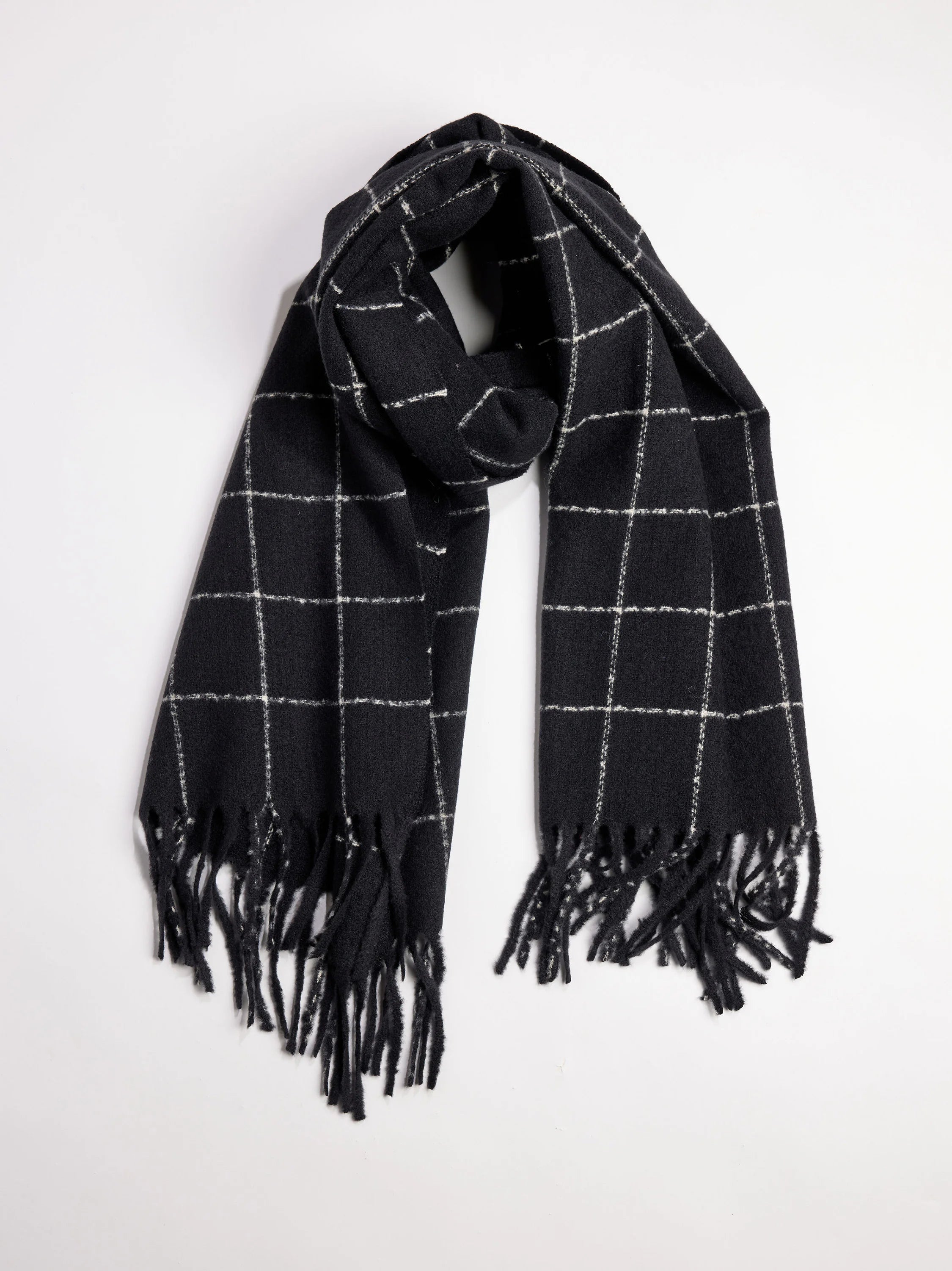 Dark gray scarf with off-white windowpane grid and fringed ends.