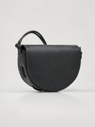 Black half-moon crossbody bag with knotted leather strap.  Subtle embossed logo.
