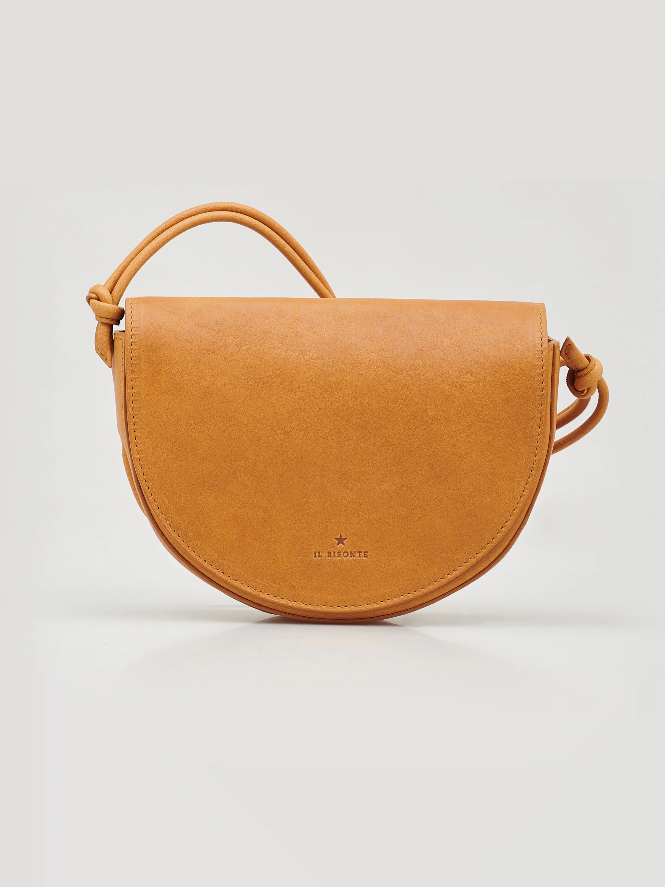 Tan leather half-moon crossbody bag with knotted straps.  Small, embossed logo.