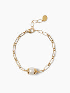 Gold chain bracelet with a large white pearl.  The clasp is gold.