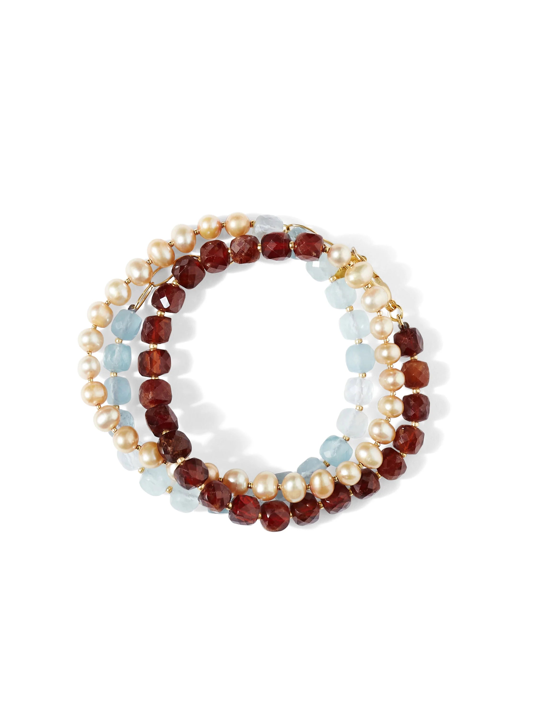 Triple wrap bracelet with pearls, light blue, and dark red stones. Gold clasp.