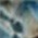 Multi-tone blend of deep blues, greens, beige, and dark grays with a smooth, marbled texture.