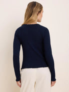 Navy pointelle rib long sleeve tee with scalloped edges at the neckline, cuffs, and hem.