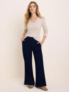 Oatmeal pointelle rib long sleeve V-neck tee with ruffled neckline, cuffs, and hem.