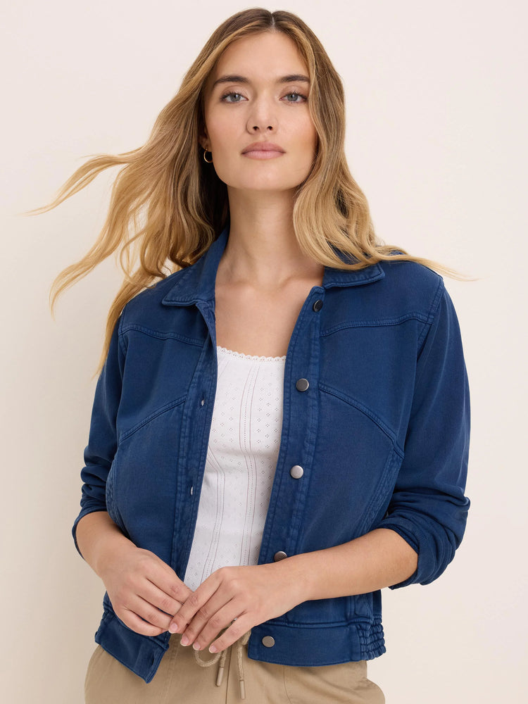 Washed blue terry bubble jacket with shirt collar, silver snap buttons, and gathered hem.