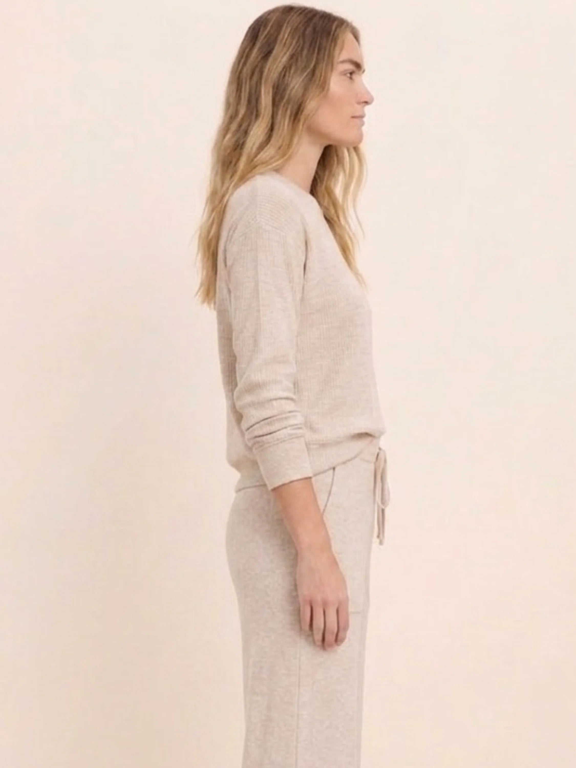 Light beige ribbed cotton terry crew-neck top with long sleeves.