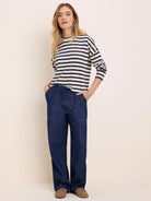 Cream and navy horizontally striped long-sleeve tee with a crew neck.