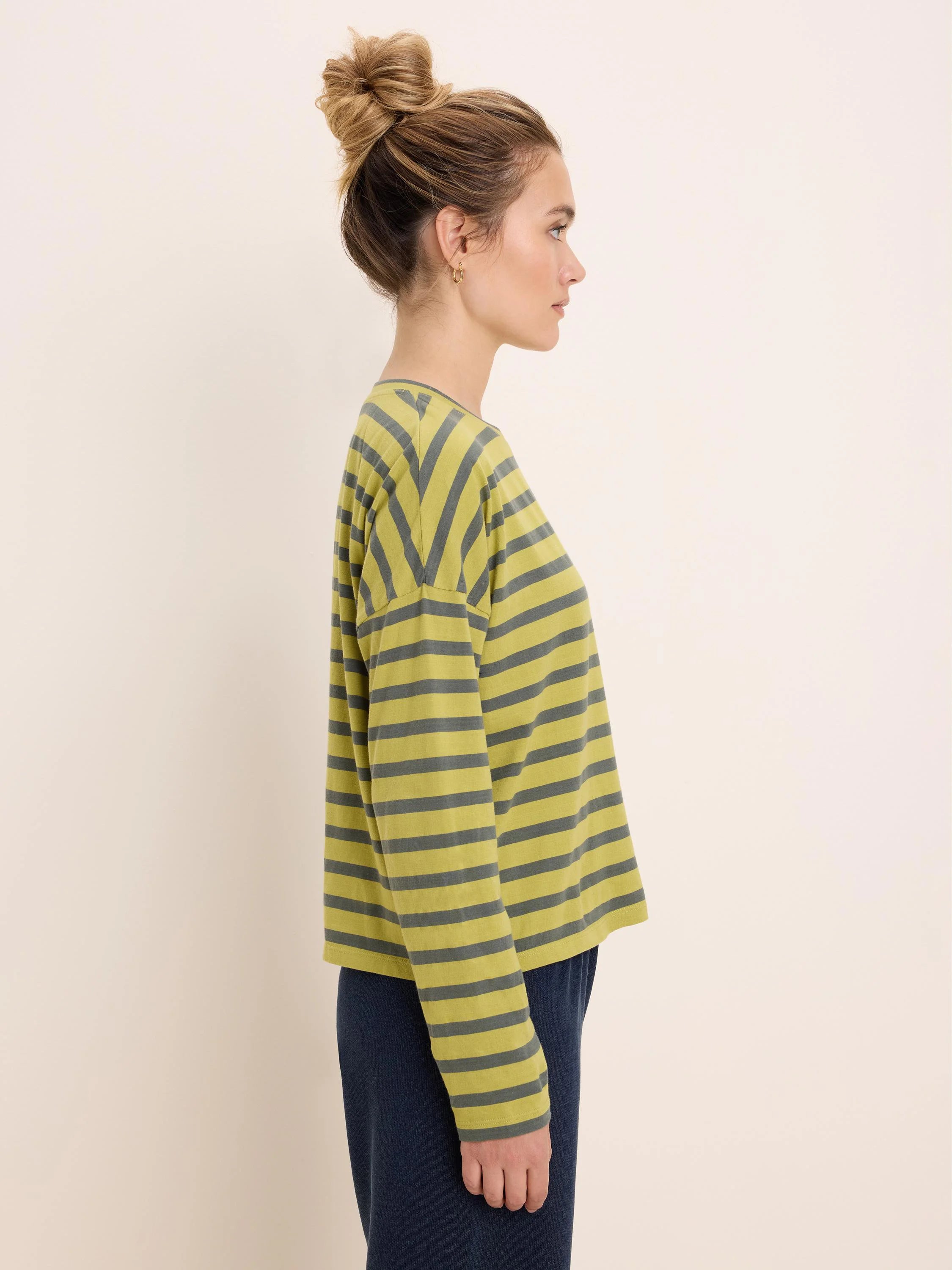Long-sleeved tee with horizontal stripes: chartreuse and charcoal gray, relaxed fit.