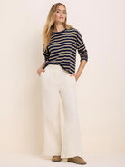 Navy and tan horizontal striped long-sleeve tee.