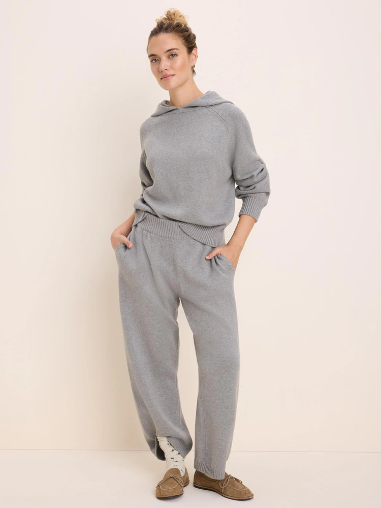 Light grey knit hoodie with a hood, raglan sleeves, ribbed cuffs and hem. Worn with matching knit pants.