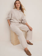 Oatmeal knit wide-leg sweater pants with an elastic waist and ribbed cuffs.