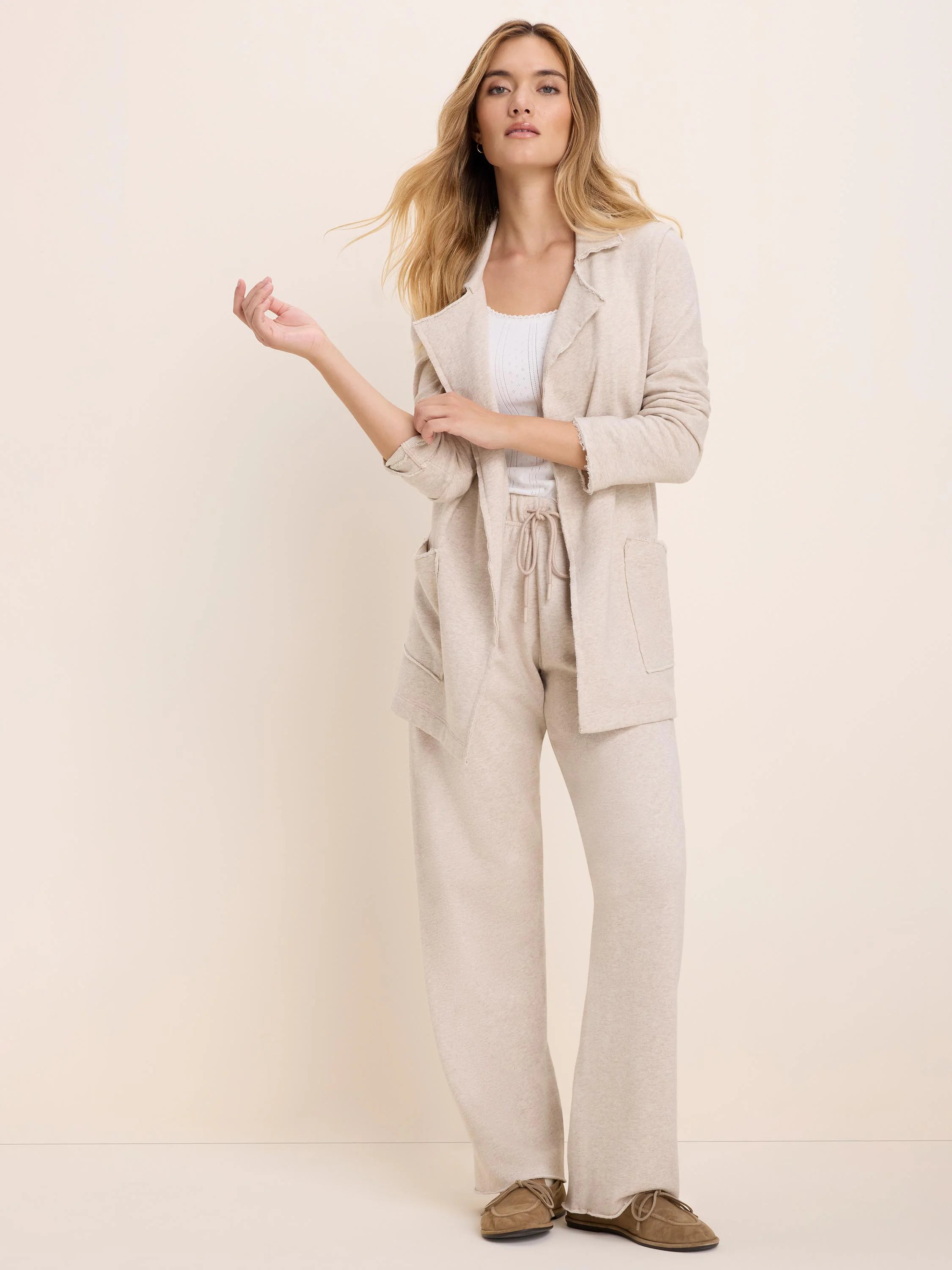 A light beige heathered wide-leg cotton terry pant with drawstring waist.