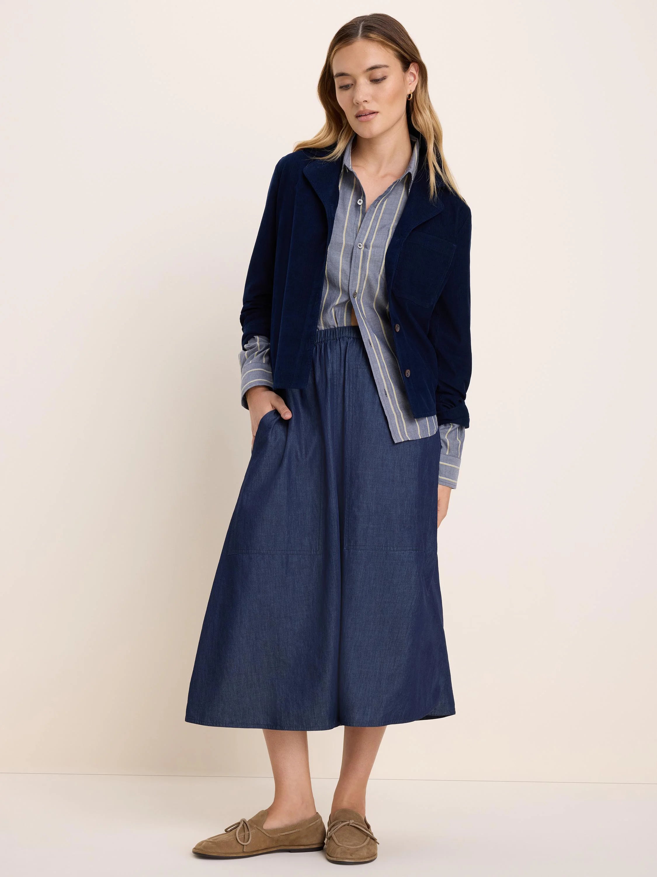 Pale blue-gray long-sleeve shirt with subtle cream vertical dobby stripes and a button-front.