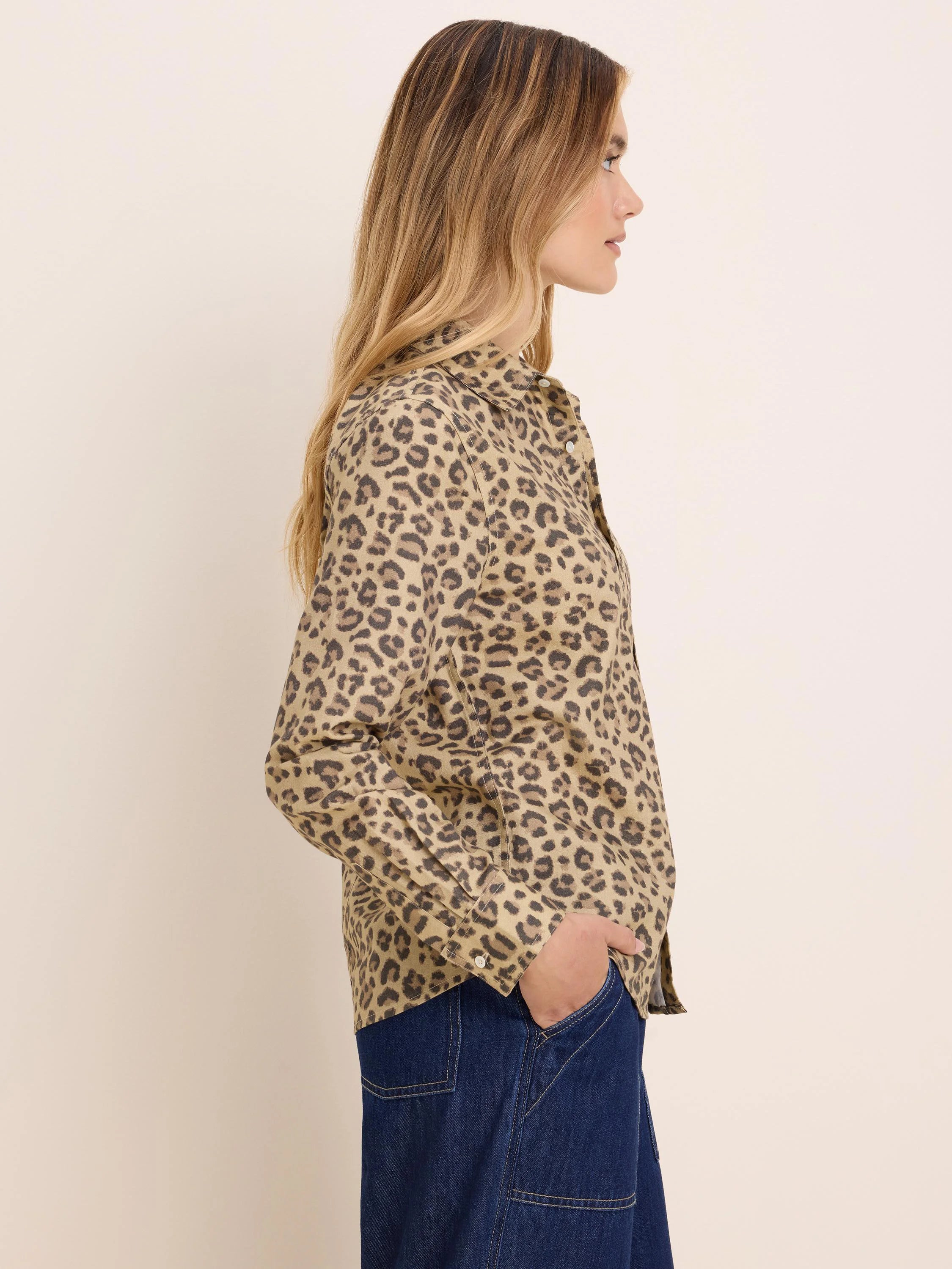 Button-up shirt, tan with dark brown cheetah print spots.