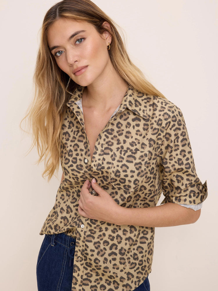 Tan button-up shirt with dark brown cheetah spots, collar, chest pocket, and rolled sleeves.