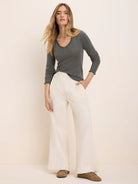 Ellis Baby Cord Pant: Off-white, wide-leg corduroy pants with a fine vertical texture and waist pleats.