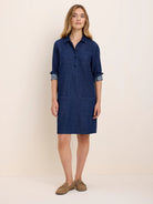 Dark blue denim dress with collar, 3-button placket, rolled 3/4 sleeves, and 4 patch pockets. Knee-length.