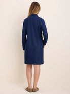 Dark blue collared denim dress, long sleeves, straight knee-length cut. Back view on model.