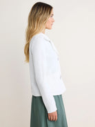 White French Terry Daily Jacket. Collared, with two visible buttons & front patch pockets. Raw-edge trim on collar & cuffs.